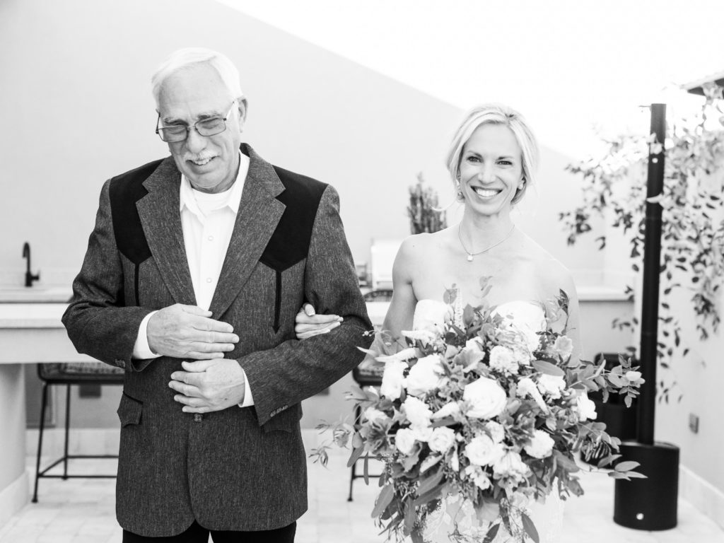 Father walks bride down the aisle at a micro wedding ceremony